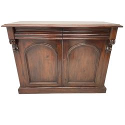 Victorian mahogany chiffonier, raised shaped back with foliage scroll carved mounts, on fretwork and carved bracket supports, moulded rectangular top over two frieze drawers and double panelled cupboard, on moulded plinth base