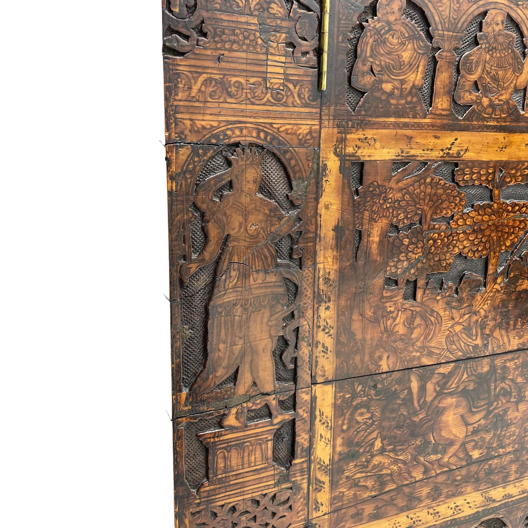 17th century and later cedarwood and pine side cupboard, moulded rectangular top, enclosed by two doors possibly removed and reused from a Venetian Cassone, carved and decorated with penwork, the upper architectural arcade with busts of noblemen, the larger decoration depicting hunters on horseback within woodland landscape with various animals, central and flanking uprights decorated with classical female figures upon pedestals, lower roundels decorated with lion and putto motifs, overall foliate decoration, raised on five hairy paw carved feet, the interior fitted with shelf