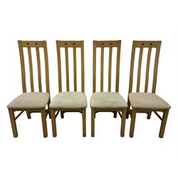 Contemporary set of four oak dining chairs, tall slatted curved backs with square cutouts to the top, upholstered seats in light fabric, on square front supports