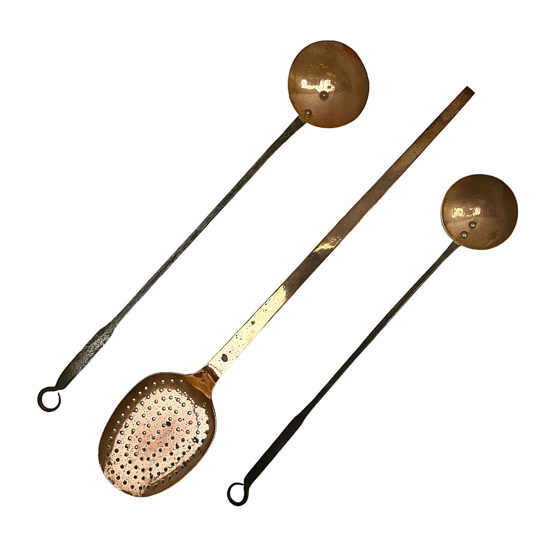 Large 19th century copper slotted spoon, with pierced flat bowl, L55cm, together with two 19th century iron handled ladles with circular copper bowls, largest example L48.5cm, (3)