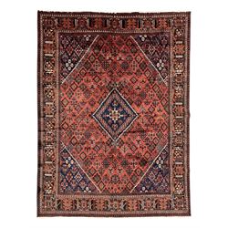 Persian Joshaghan red ground rug, stepped lozenge medallion surrounded by small lozenge mo...