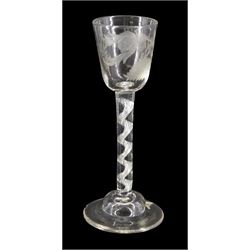 18th century drinking glass, the rounded funnel bowl engraved with thistle and floral sprig, upon a single series air twist stem and domed foot, H16cm
