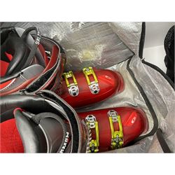 Three sets of Salomon ski boots (two as new), together with associated clamps