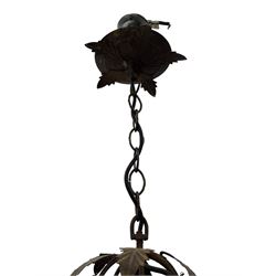 Early 20th century wrought metal chandelier, of scrolled form with six branches, decorated with leafage and glass pendants 