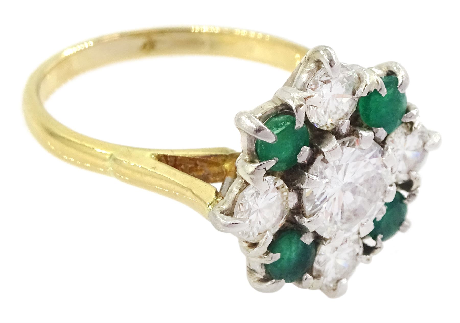 18ct gold emerald and diamond cluster ring, the central round brilliant cut diamond of approx 0.80 carat, with four stone round cut emerald and four stone round brilliant cut diamond surround, Sheffield 1977, total diamond weight approx 1.70 carat