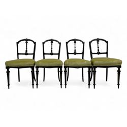 Set of four late Victorian ebonised dining chairs, decorated with carved and gilt foliate ...