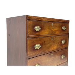 George III mahogany chest, rectangular ebony strung top, fitted with three graduating cock-beaded drawers with oval pressed brass handle plates and demi-lune handles, on tall bracket feet 