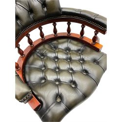 Captain's standard desk chair, upholstered in studded green leather