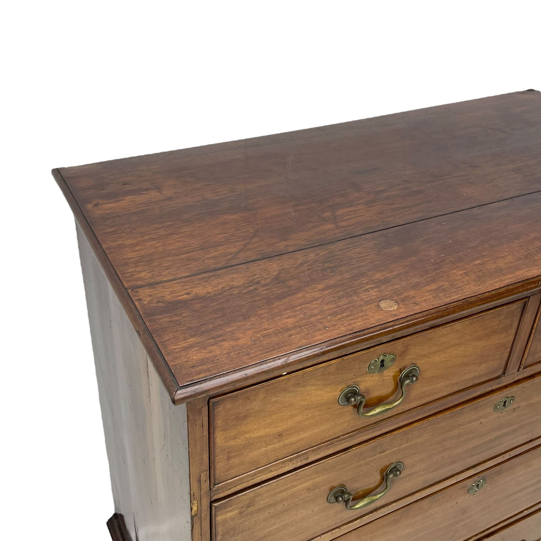 George III mahogany chest, moulded rectangular top over two short and three long cock-beaded drawers, fitted with brass swan neck handles and circular plates, on bracket feet