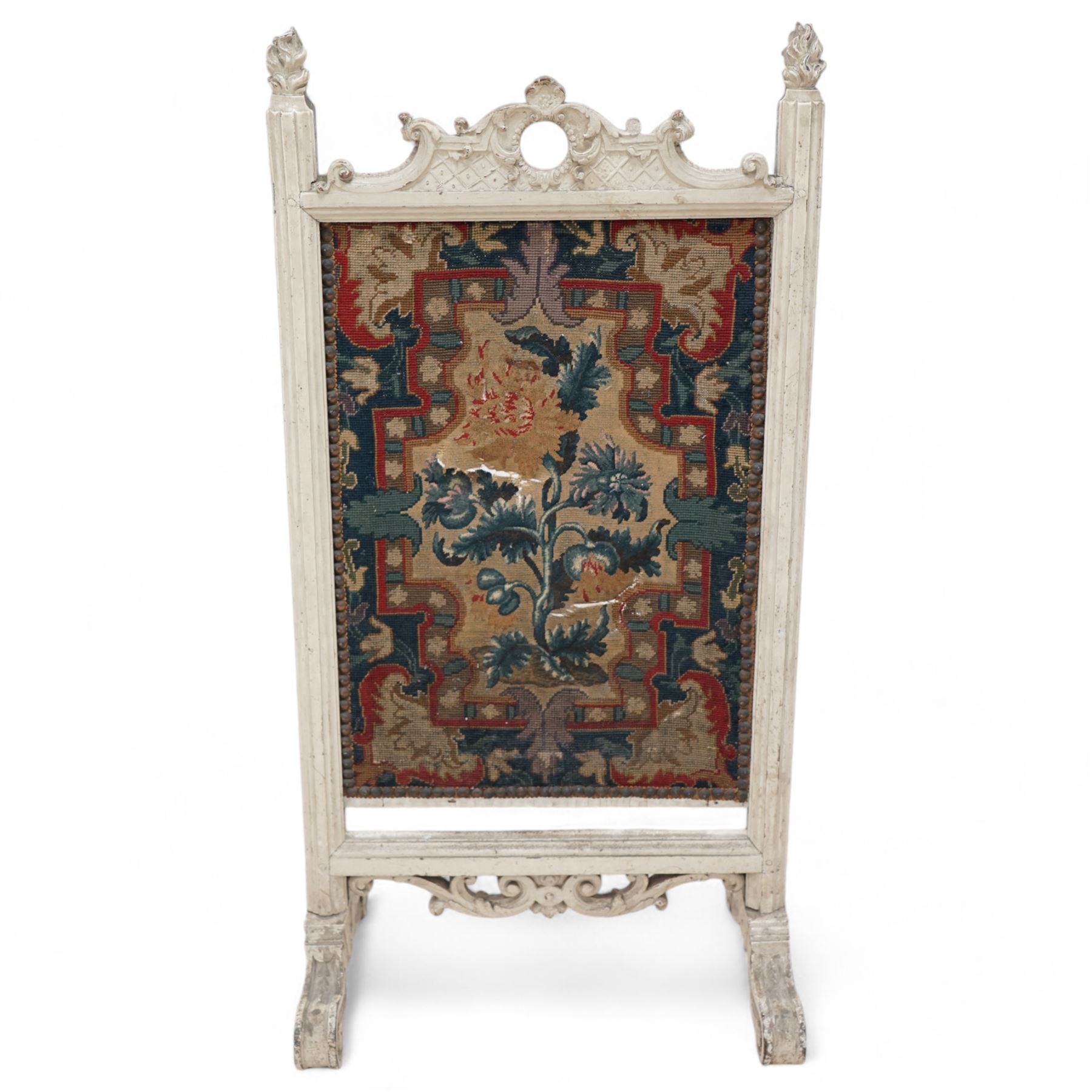 19th century carved wood fire screen, with lift-up tapestry panel, pierced pediment carved with C-scrolls and curled leaves, flanked by moulded uprights with torch finials, on scrolled out splayed feet 