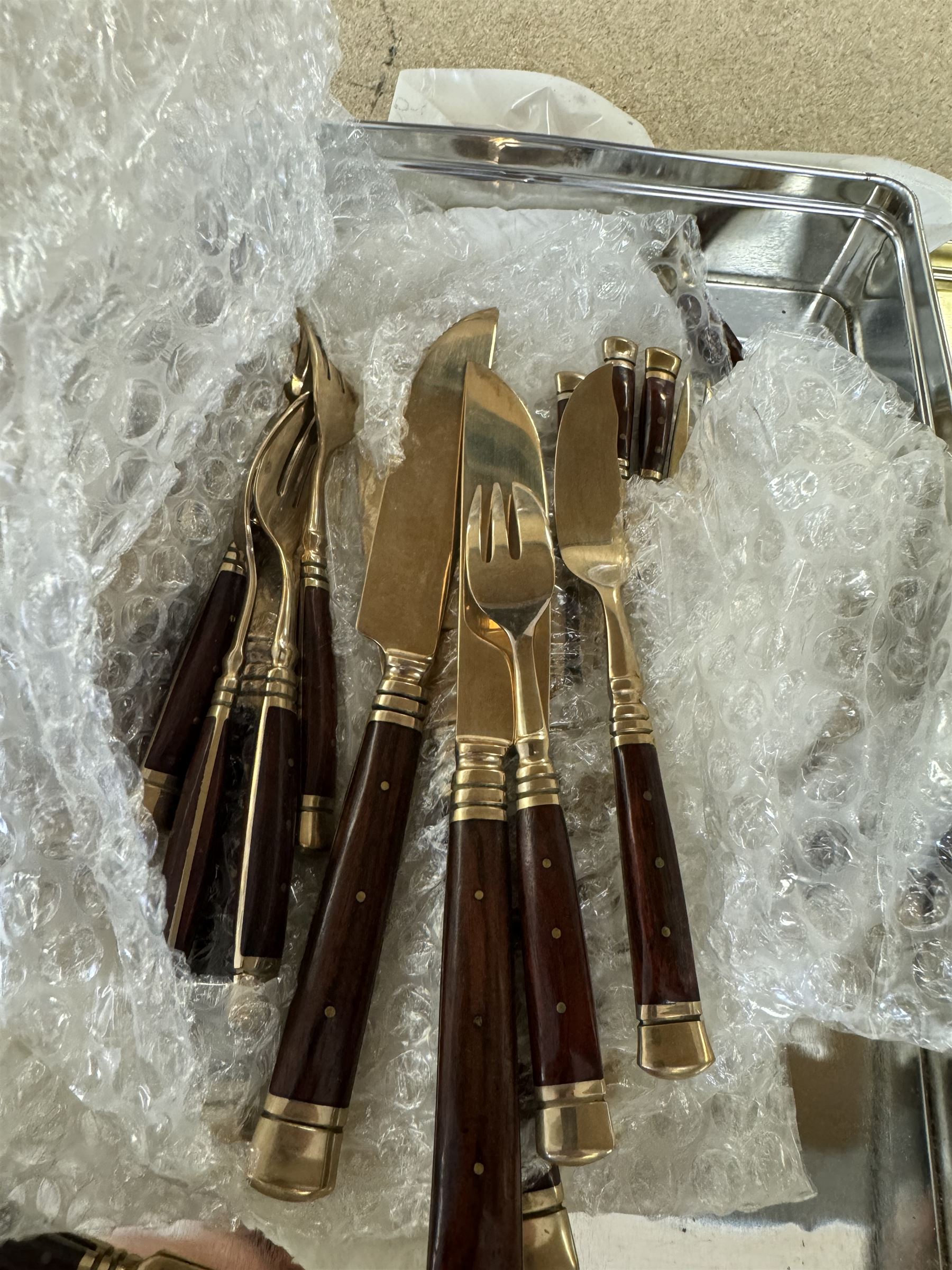 Wooden cased six place Thai gilt metal canteen of cutlery, together with additional matching flatware 