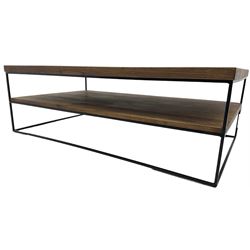 Samba oak coffee table, rectangular top over undertier storage, applied mid-tone finish, supported by black metal frame