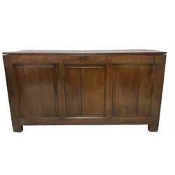 Large 18th century oak coffer or blanket box, hinged lid over triple panelled front, panelled back and sides, on stile supports 