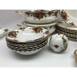 Royal Albert Old Country Roses pattern part tea and dinner service, to include two tureens, eight dinner plates, six side plates, twelve bowls, two mugs, seven teacups and saucers, milk jug,  twelve cake plates, six soup bowls and saucers, candlesticks, etc (95)