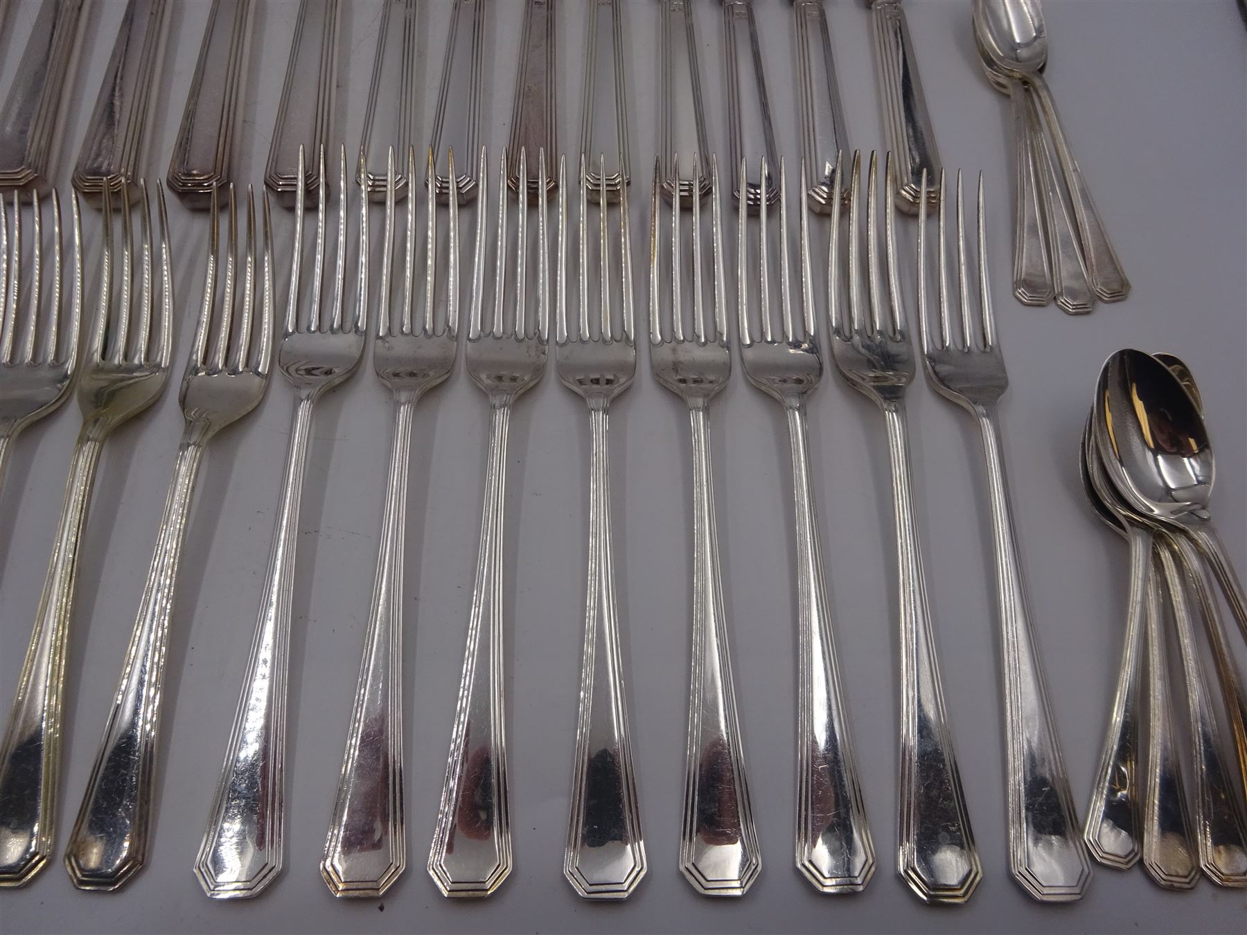 Mappin & Webb Athenian pattern silver cutlery for eight place settings, comprising table forks, silver handled table knives, dessert spoons, dessert forks, silver handled butter knives, soup spoons and teaspoons, hallmarked Mappin & Webb Ltd, Sheffield 1978, contained within anti-tarnish fabric wraps and boxed 