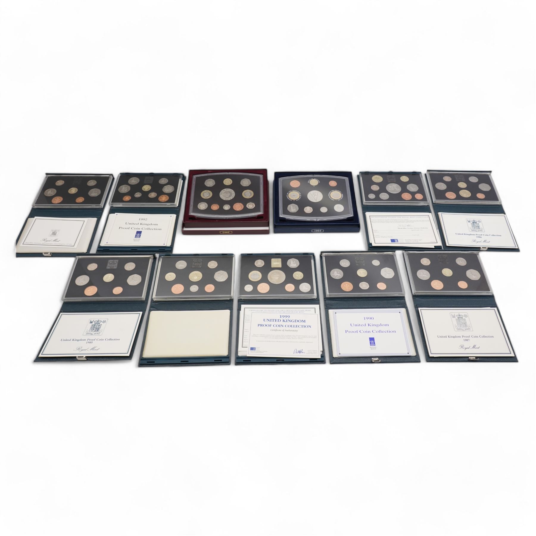 Eleven The Royal Mint United Kingdom proof coin collections, dated 1985, 1986, 1987, 1988, 1990, 1992 with dual dated fifty pence, 1994, 1996, 1999, 2001 and 2003, all cased with certificates