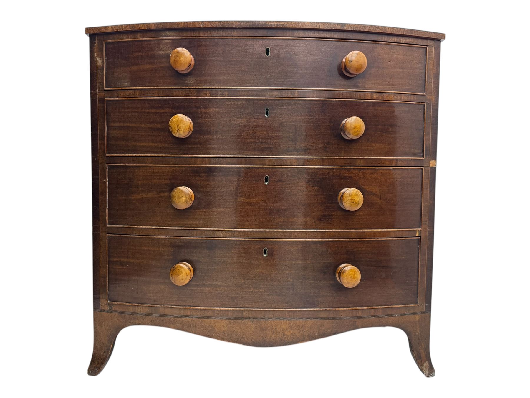 Victorian mahogany bow-fronted chest, fitted with four long graduating cock-beaded drawers, shaped apron on splayed bracket feet