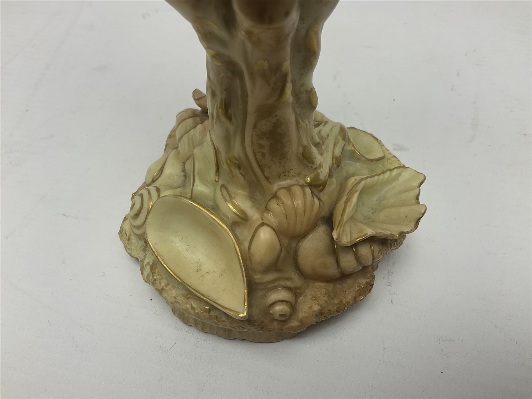 Royal Worcester blush ivory Nautilus shell with coral shape support and decorated with shells to base, mark beneath, H17cm  