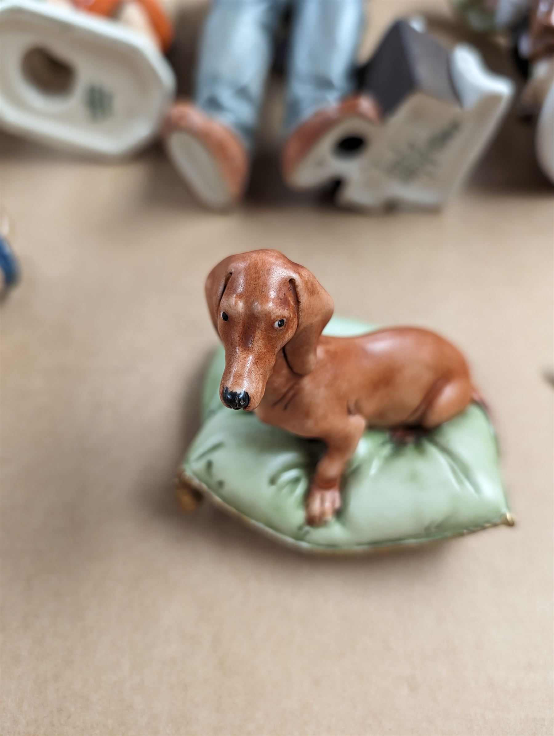 Collection of figures, including bunnykins, two Royal Doulton figures and a Capodimonte dog