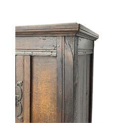 17th century and later oak hall cupboard, panelled front and sides with moulded frame, enclosed by single door with wrought metal hinges and handle, the interior fitted with hooks, on stile supports 