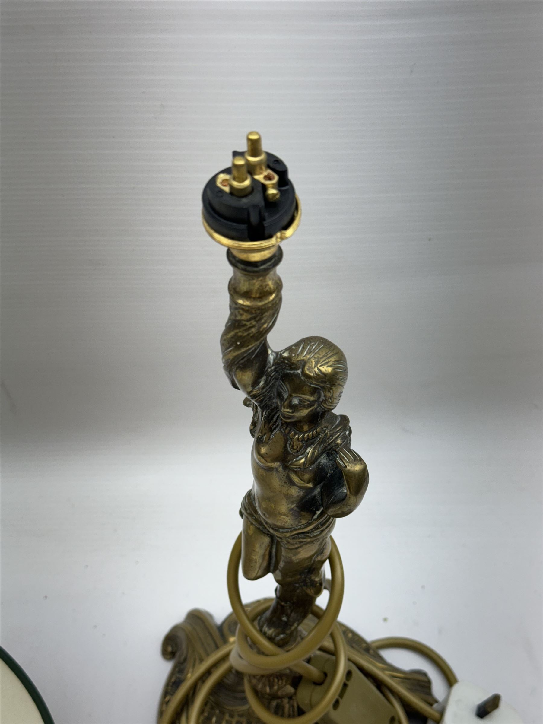 Gilt metal table lamp, modelled as a classical female figure holding the shade aloft in one hand, upon a spreading base, including shade H51cm