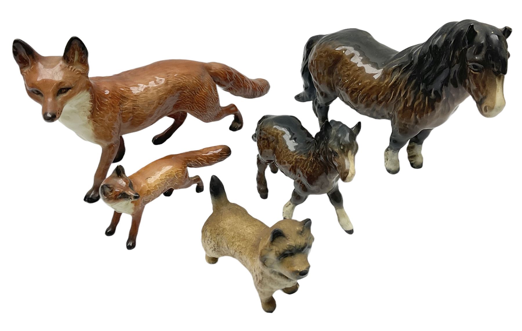 Five Beswick figures, comprising Wooly Shetland no 1033, Wooly Shetland Foal no.1034, Cairn Terrier no.2112, large Fox no. 1016 and standing fox no. 1440