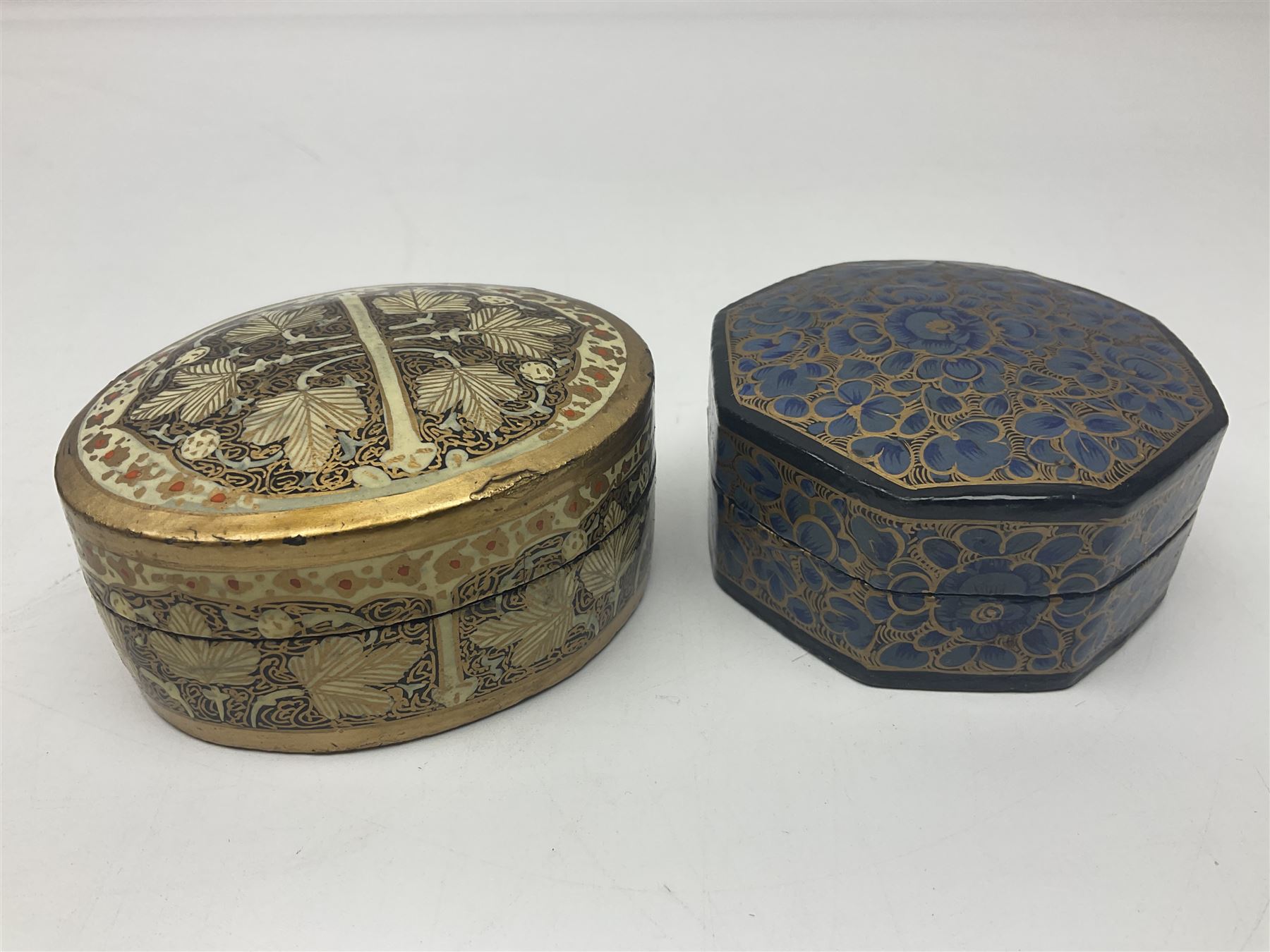 Twelve lacquered boxes, to include square and oval examples, with floral decorations, tallest H5cm