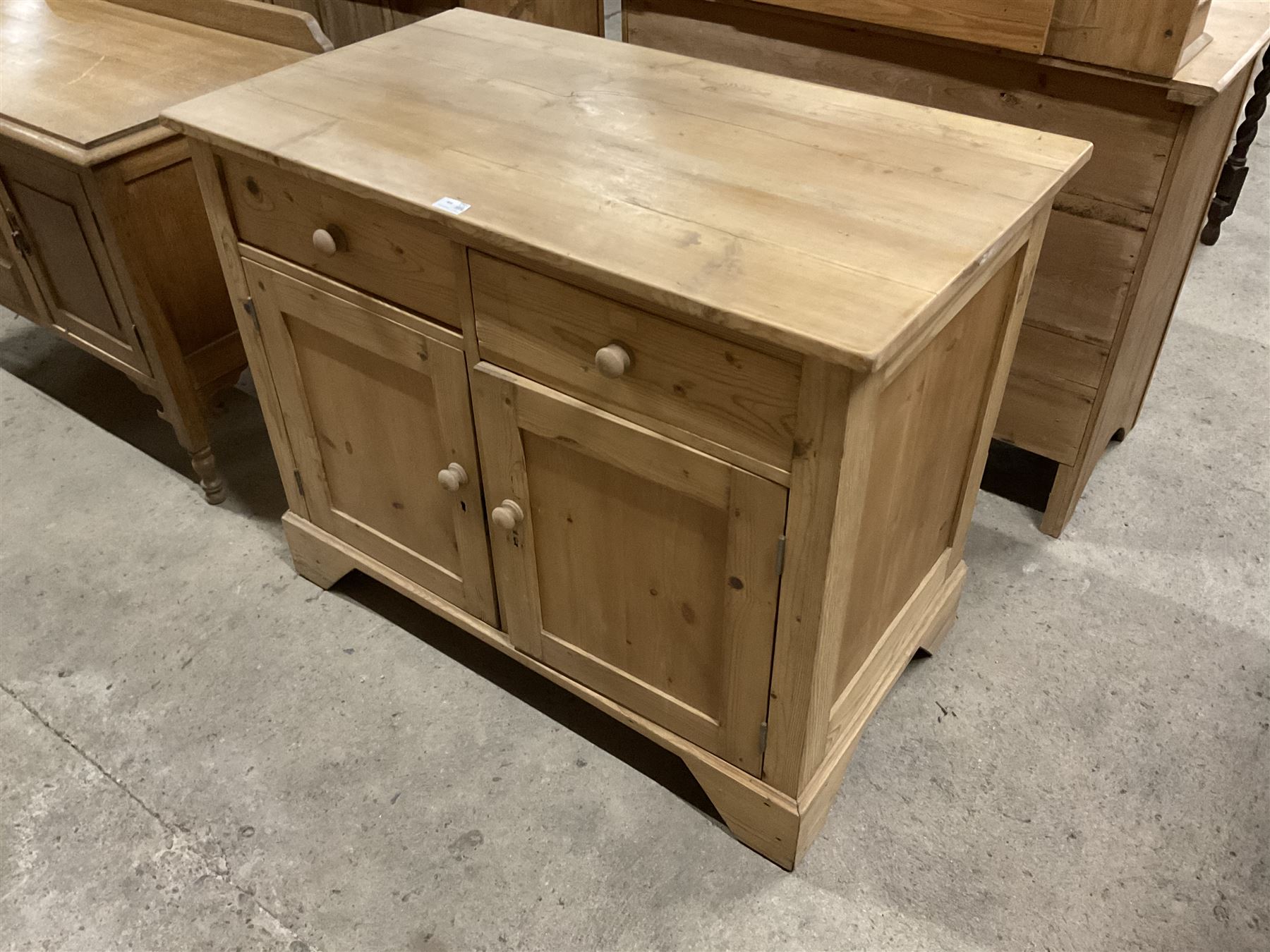 Traditional pine cupboard, fitted with two drawers over two panelled cupboards  - THIS LOT IS TO BE COLLECTED BY APPOINTMENT FROM THE OLD BUFFER DEPOT, MELBOURNE PLACE, SOWERBY, THIRSK, YO7 1QY