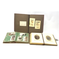 Three albums, the first entitled The Artistic Series of Private Christmas Cards, containing a selection of assorted Christmas related greeting cards, the second containing various postcards, some of local interest to Scarborough, some silk examples, and the third a photographic album. 