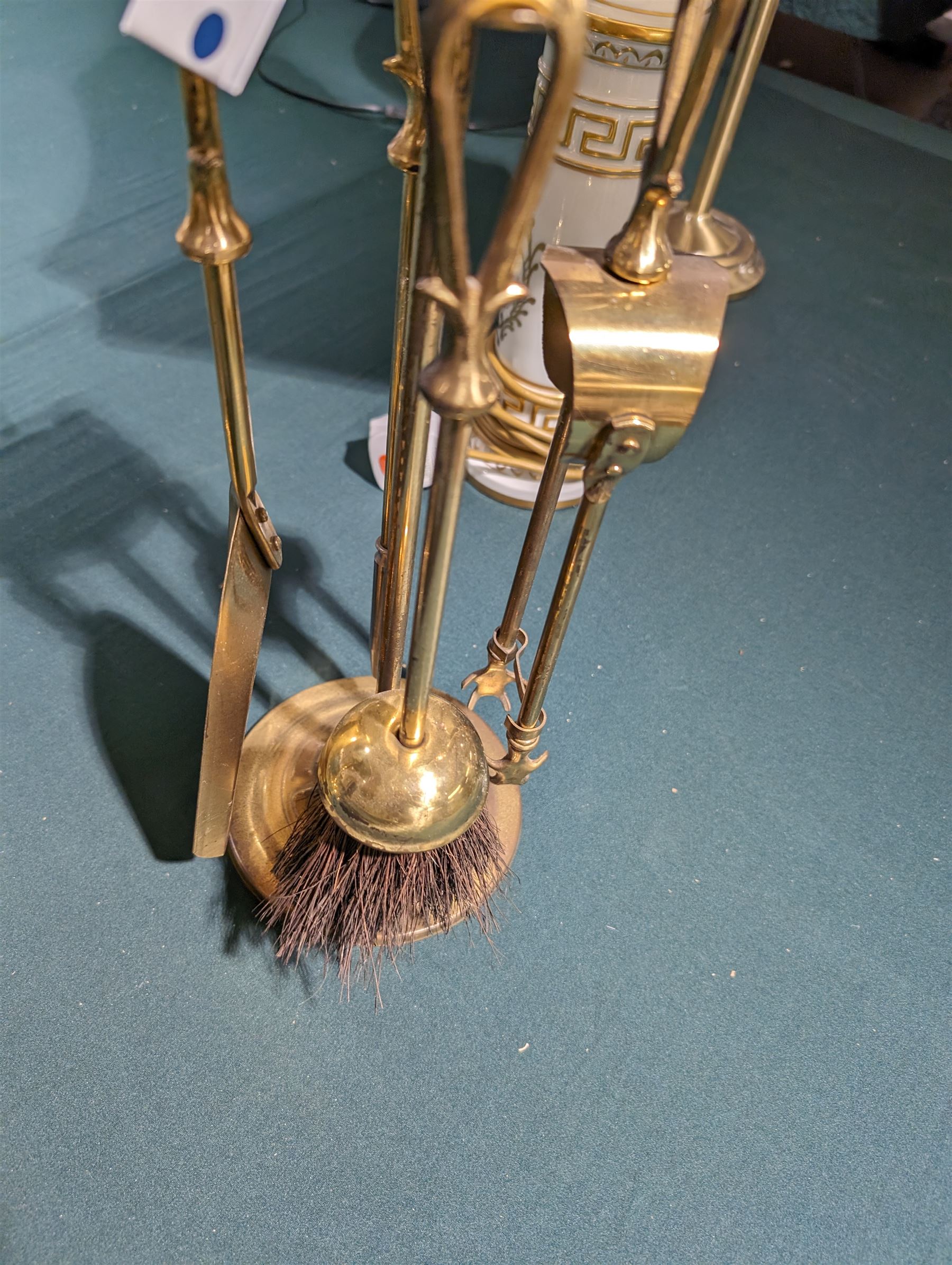 Adjustable brass lamp, Porcelain de France lamp and one other brass lamp, together with a brass fireside compendium 