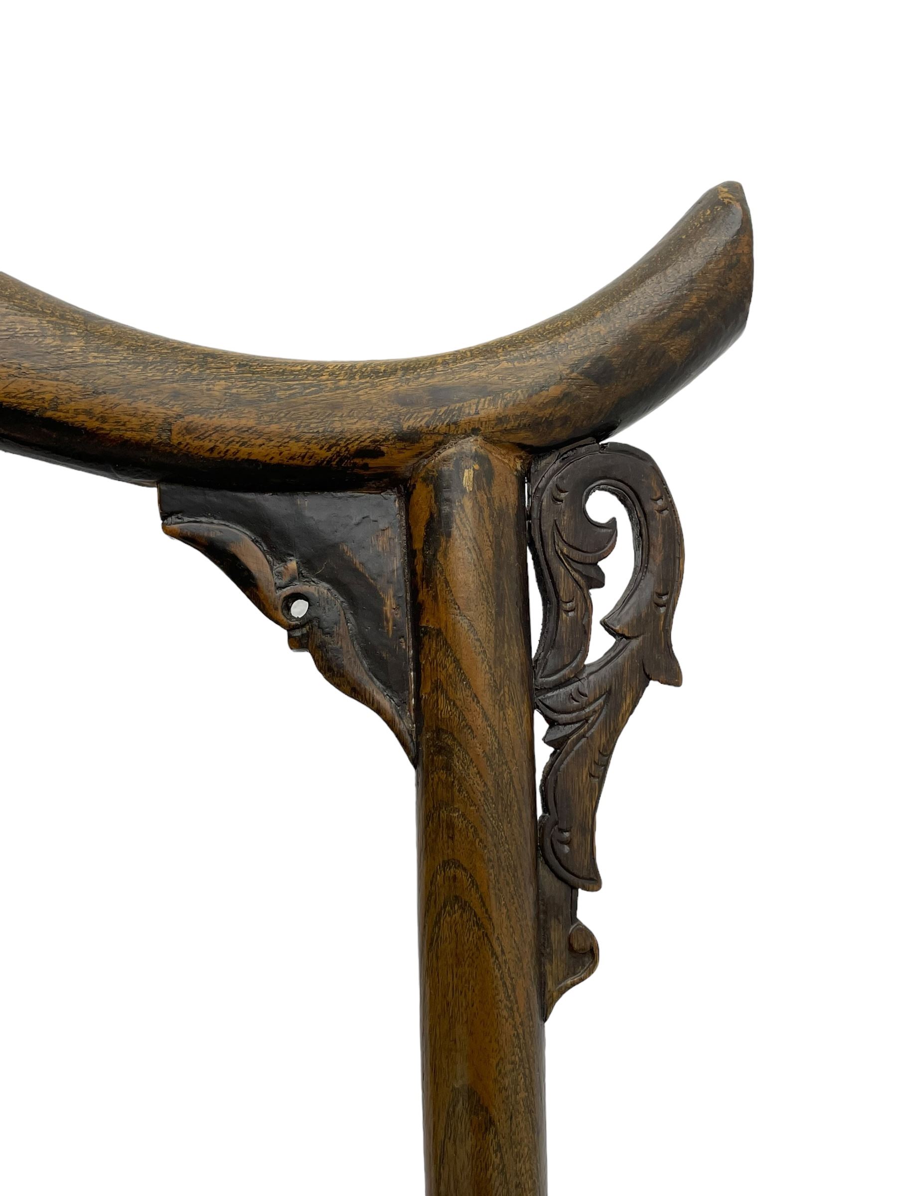 Chinese design elm yoke back 'official's' armchair, the shaped cresting rail over splat decorated with carved and pierced wildlife scenes, shaped projecting arms over rectangular seat, square supports united by plain stretchers, decorated with shaped frame brackets carved with foliage