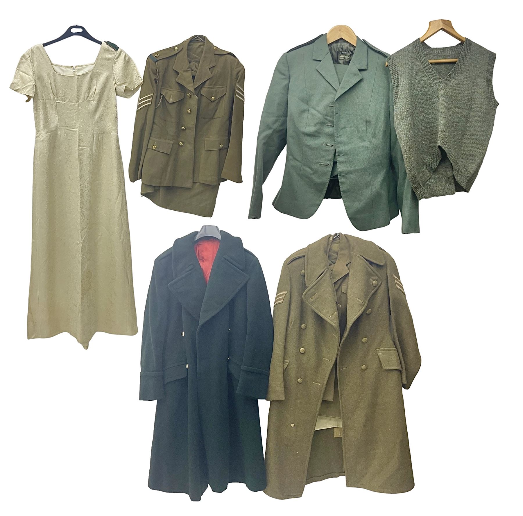 WW2 British female ATS Sergeant's service uniform grouping, consisting of four pocket female pattern service dress tunic with brass ATS shoulder titles and general service buttons; cloth lined interior with the original printed size label dated 1942; the matching khaki service dress skirt; and Greatcoat with size label dated 1945; together with army knitted sleeveless V-neck jumper; WRAC tunic, skirt and overcoat; full length cream and gold thread military evening dress by Hilliers Couture; and four webbing belts