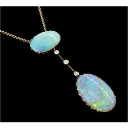 Early 20th century gold opal and diamond pendant necklace, two oval cabochon cut opals spaced by three milgrain set old cut diamonds, total opal weight approx 16.85 carat