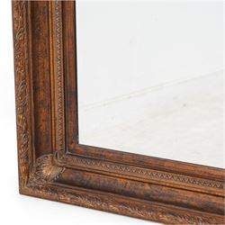 Gilt framed wall mirror, the moulded rectangular frame decorated with trailing laurel leaves and acanthus leaves, bevelled mirror plate 