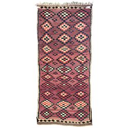 Turkish Anatolian lilac ground kilim rug, the field decorated with three columns of geometric lozenges, enclosed by plain guard stripes 