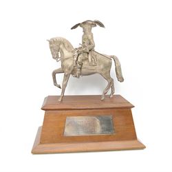 'The Scottish & Newcastle Breweries Handicap Sweepstakes 1972, Won by Warpath, Owned and Bred by Mr Guy Reed, Trained by S Hall, Ridden by A J Russell' - Cast silver figure of a cavalier on horseback 25cm x 21cm on a mahogany plinth with silver plaque 38cm x 33cm overall London 1969 Maker Edward Barnard & Son 