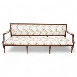 Late 19th century Swedish beech-framed settee, upholstered in cream fabric with trailing foliate pattern decorated with flowers, carved and moulded frame, scroll carved arm terminals on shaped moulded arm supports, on turned and fluted feet