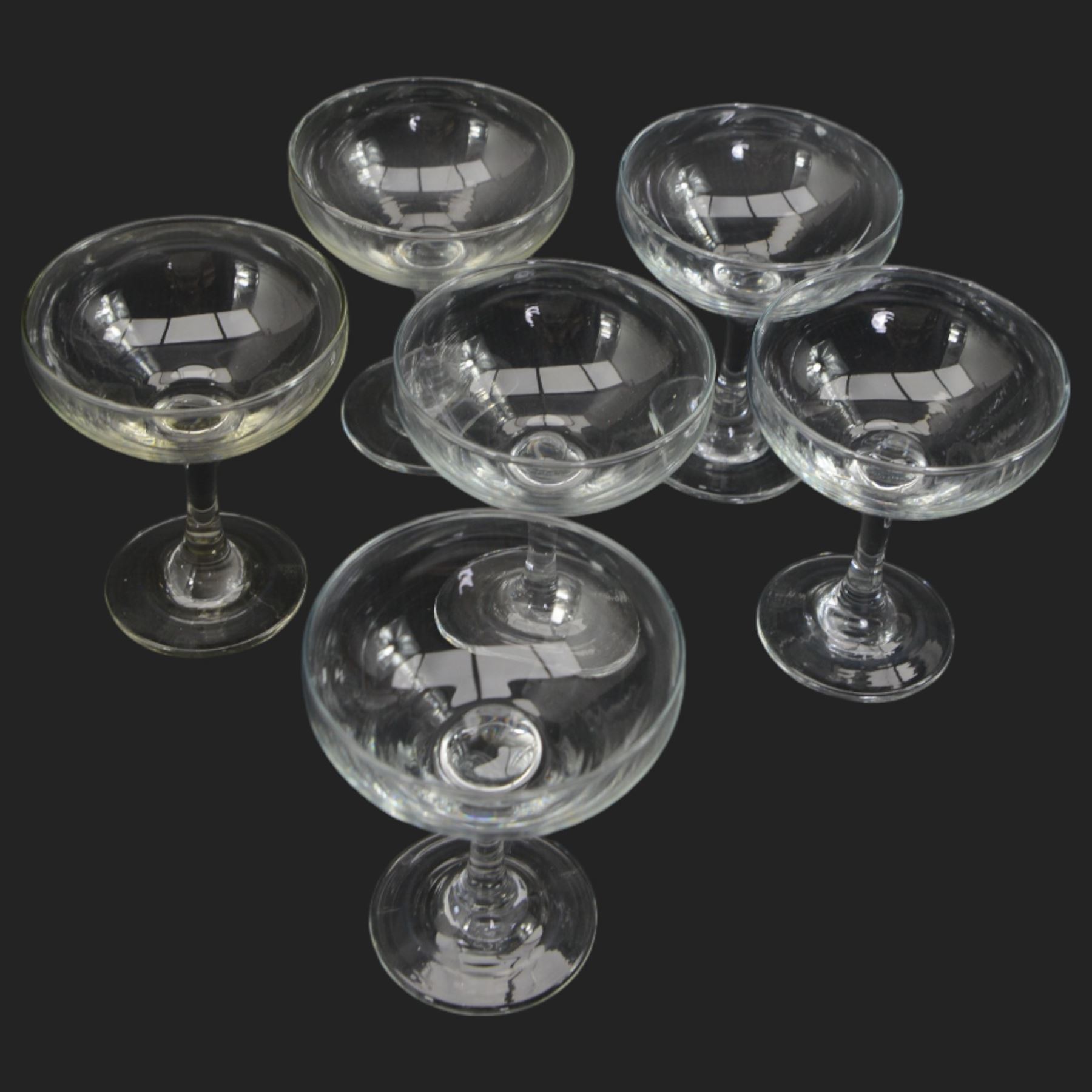 Dartington Ripple pattern fruit set comprising thirty bowls and serving bowl and a number of plain glass champagne saucers