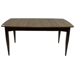 Mid-20th century figured walnut extending dining table, pull-out action with fold-out leaf, on tapering supports 