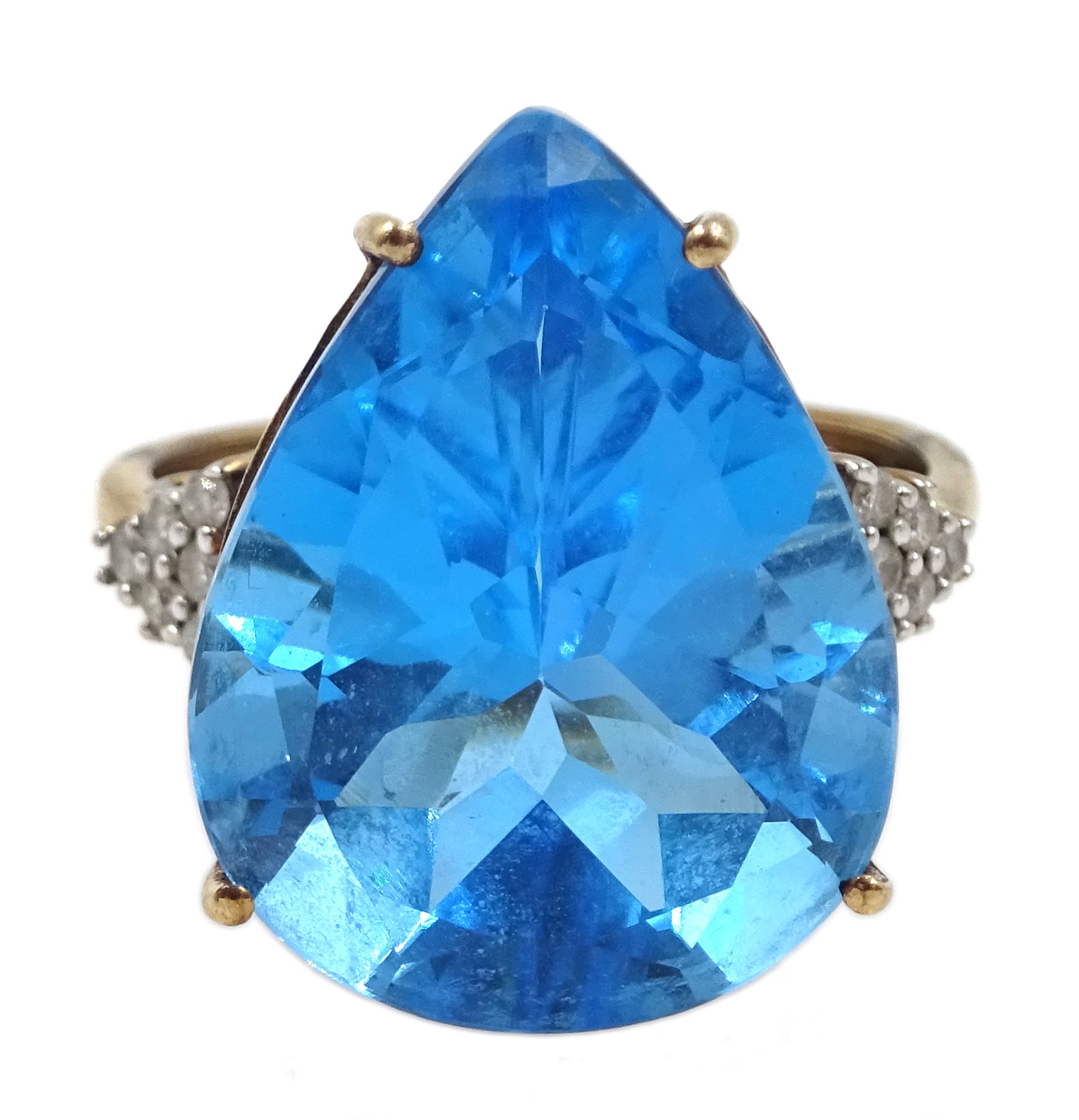9ct gold pear shaped blue topaz ring, with diamond set shoulders ...