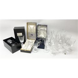 Modern Commemorative and souvenir drinking glasses, to include three boxes examples, and examples by Webb, Stuart, and Caithness, a number of Royal Commemorative examples, and examples with air twist and baluster stems. 