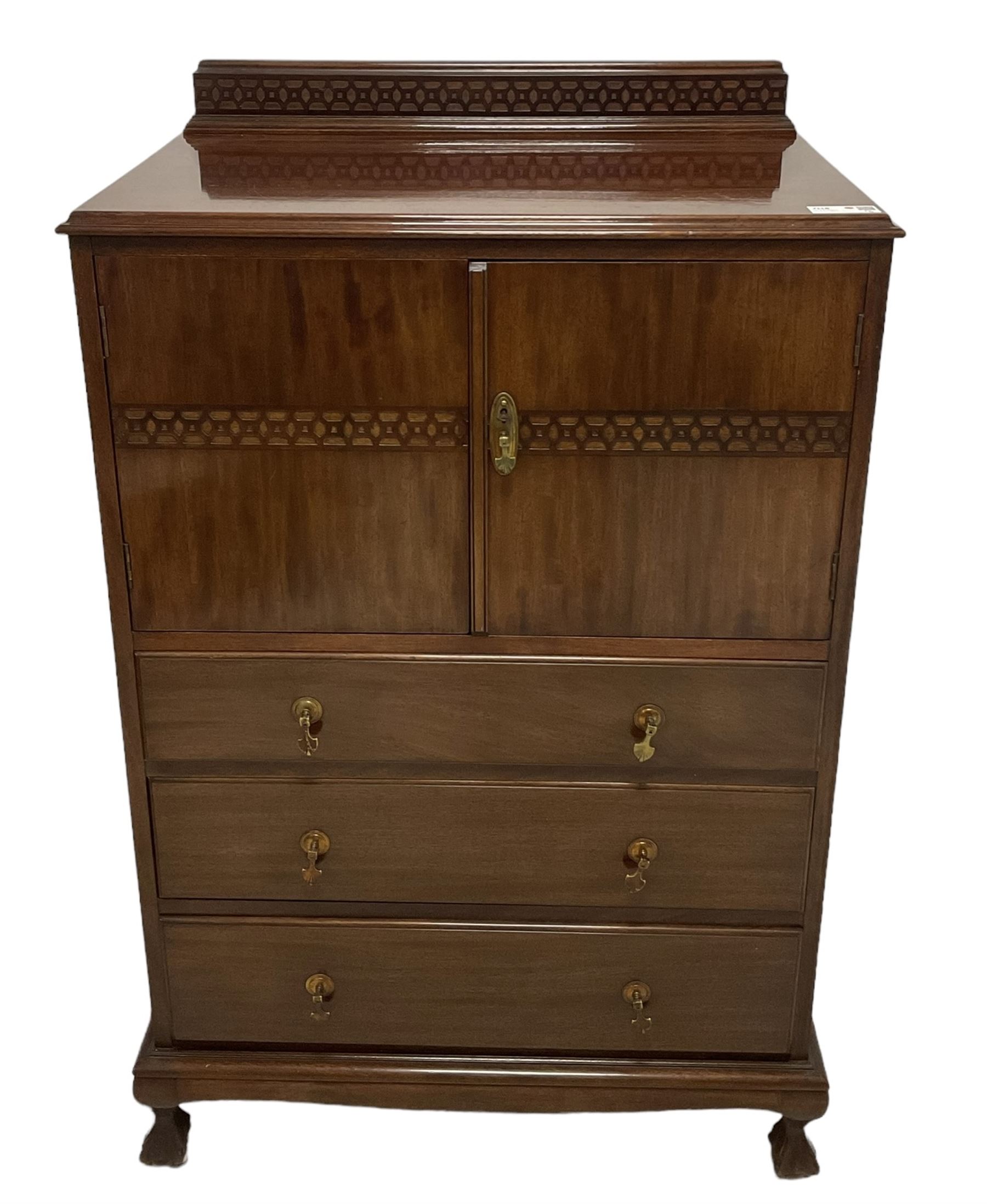 Early 20th century mahogany tallboy, double cupboard over three drawers, on ball and claw carved cabriole feet