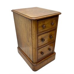 Pair of Victorian figured mahogany pedestal chests, rectangular form with rounded front corners, moulded top over three drawers with applied mouldings and turned handles, on moulded plinth base