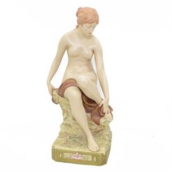 Large early 20th century Royal Dux figure of a nude female bather, seated upon a rocky base, model no. 1379, applied triangle mark beneath, H49cm 