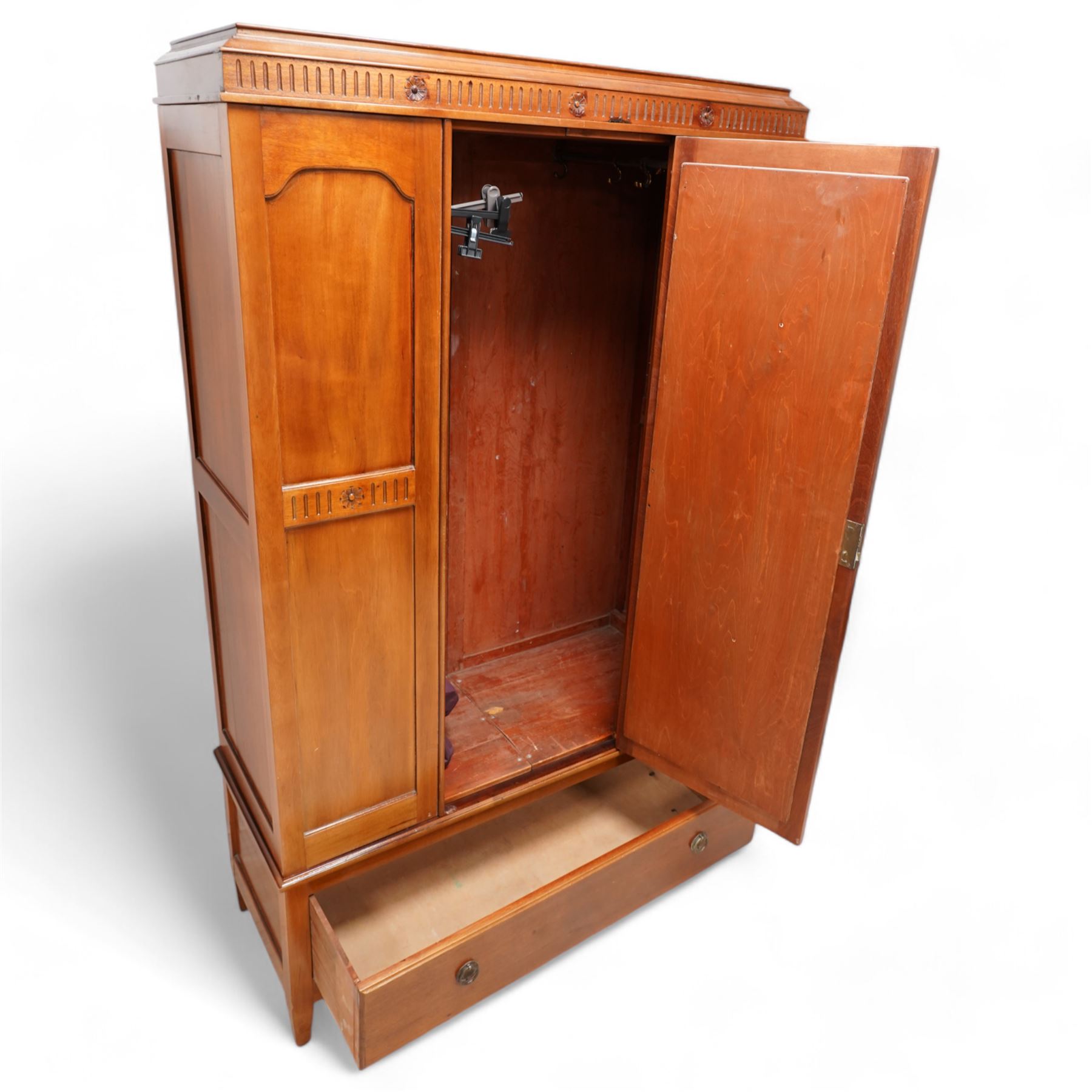 Early 20th century mahogany three piece bedroom suite - comprising a triple wardrobe (W119cm D47cm H194cm); chest with raised back, fitted with four long drawers (W93cm D49cm H115cm); and dressing table with swing mirror back (W108cm D49cm H152cm), each decorated with rosette and fluted designs, on square tapering feet