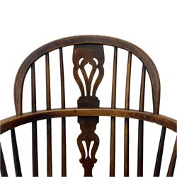 19th century yew wood and elm Windsor armchair, low double hoop stick and pierced splat back, dished seat on turned supports united by crinoline stretchers