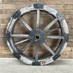 Large wood and metal bound cart wheel