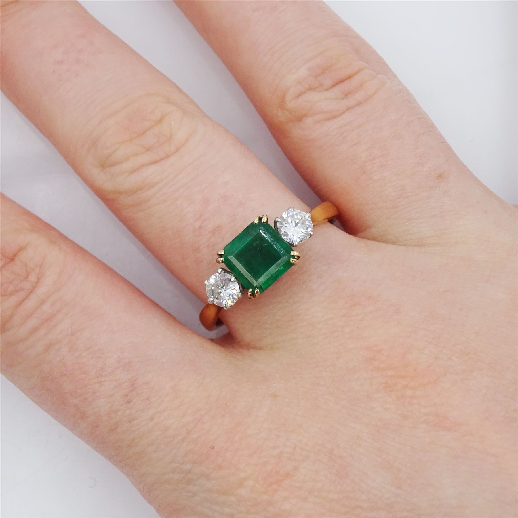 Gold three stone emerald and round brilliant cut diamond ring, stamped 18ct Plat, emerald approx 1.20 carat, total diamond weight approx 0.50 carat