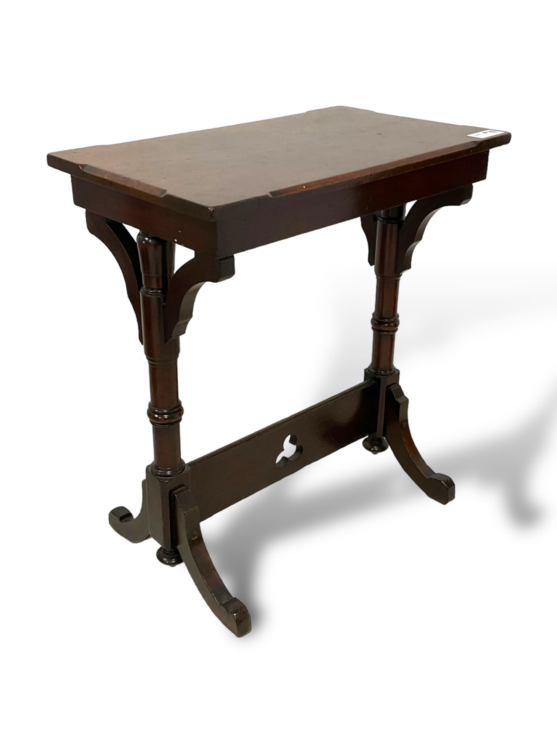 Late Victorian walnut ecclesiastical side table, rectangular top with stop chamfered edge, on turned supports united by rectangular stretcher pierced with trefoil, on splayed feet 