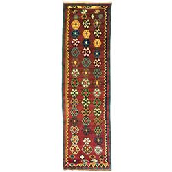 South West Persian Qashqai Kilim, crimson ground and decorated with three rows of geometric motifs, within zig-zag borders 